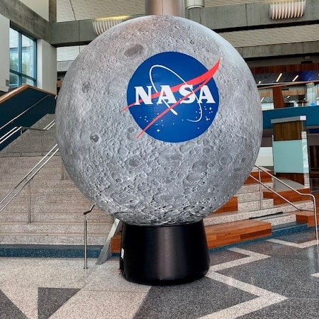 sculpture of moon with NASA logo