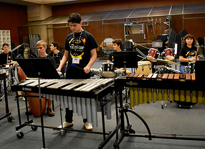 Student playing an instrument at the percussion summer camp