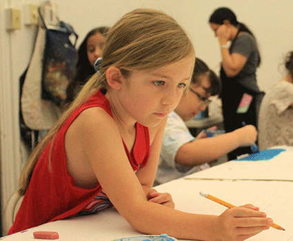 SA young student takes part in one of the summer camp classes at UTSA Southwest.